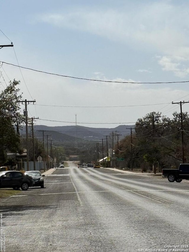 401 E Fourth St, Camp Wood, TX 78833 - view of asphalt street featuring a mountain view