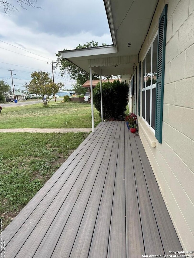 401 E Fourth St, Camp Wood, TX 78833 - wooden terrace featuring a lawn
