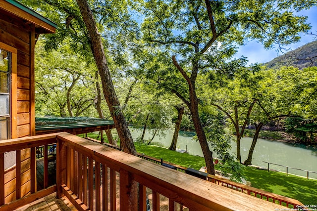 wooden terrace with a water view