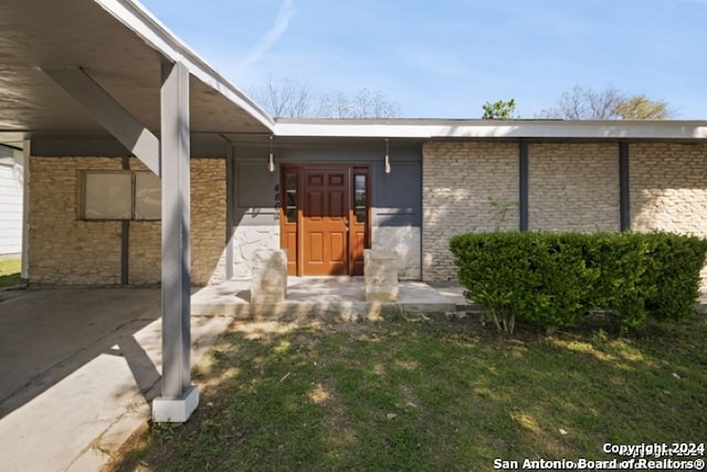 view of exterior entry with stone siding