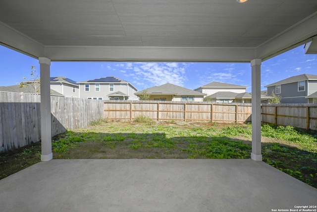 view of patio featuring a residential view and a fenced backyard