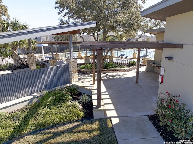 view of patio featuring fence