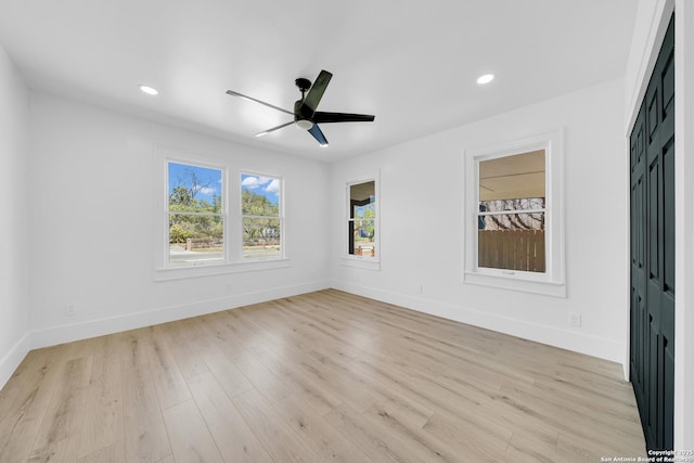 empty room featuring recessed lighting, baseboards, light wood-style floors, and a ceiling fan