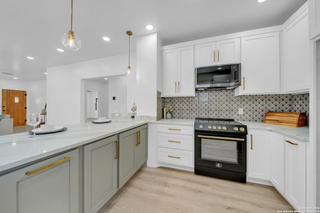 kitchen with light stone counters, electric range, white cabinetry, stainless steel microwave, and light wood-type flooring