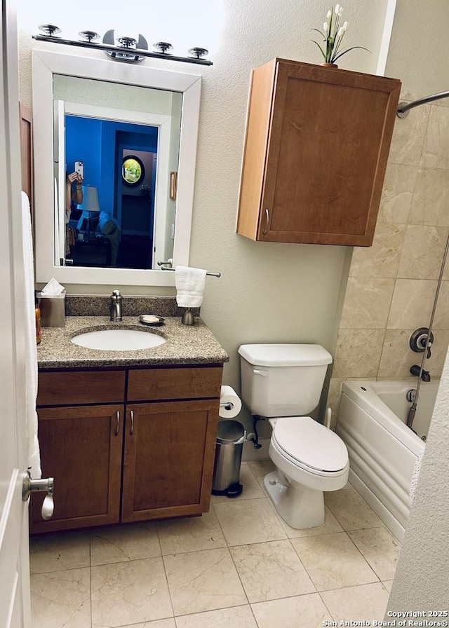 full bath featuring vanity, shower / bathing tub combination, toilet, and marble finish floor