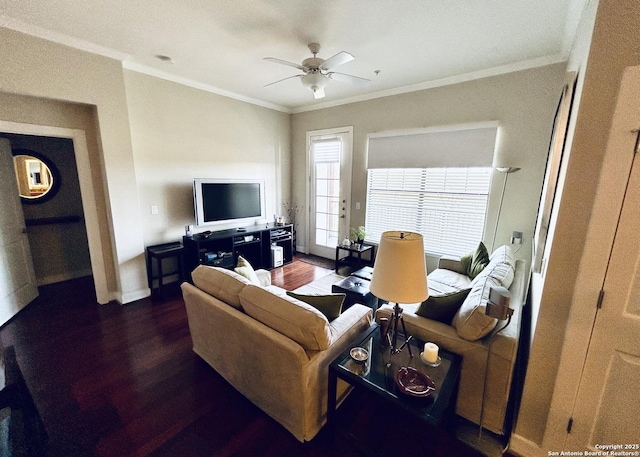 living room featuring ceiling fan, baseboards, wood finished floors, and ornamental molding