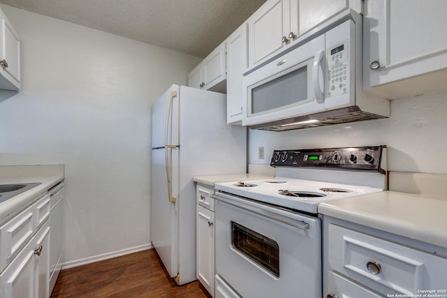 kitchen featuring white cabinetry, white appliances, dark wood-style floors, and light countertops