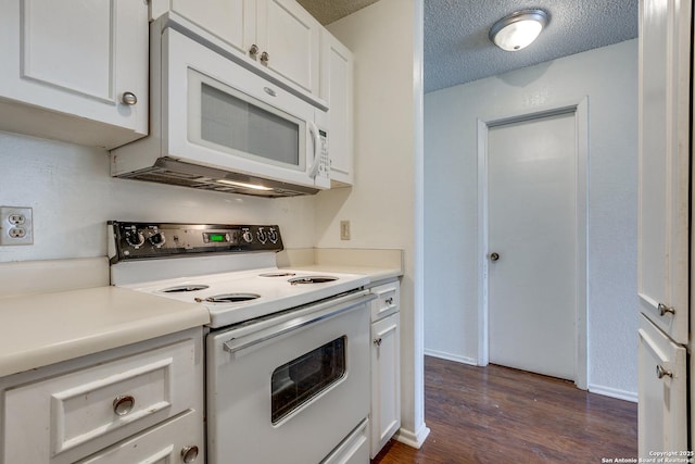 kitchen featuring white appliances, dark wood finished floors, light countertops, a textured ceiling, and white cabinetry