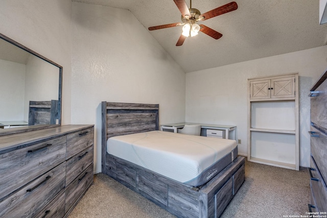 bedroom with ceiling fan, lofted ceiling, light colored carpet, and a textured ceiling