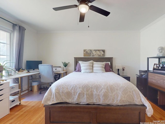 bedroom with a ceiling fan, light wood-type flooring, and ornamental molding