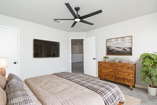 bedroom featuring visible vents, baseboards, carpet, and ceiling fan