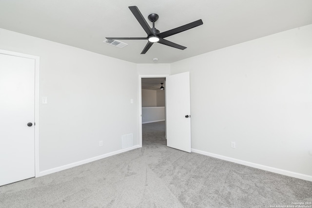 unfurnished bedroom with carpet, visible vents, and baseboards