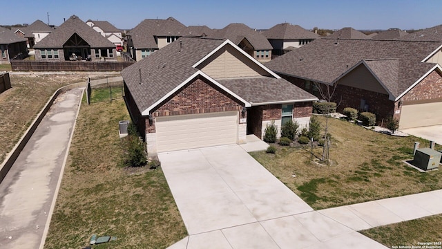 view of front of property with brick siding, a shingled roof, a residential view, a garage, and driveway