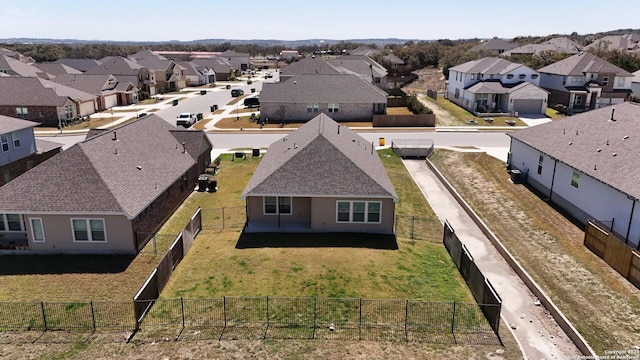 birds eye view of property with a residential view