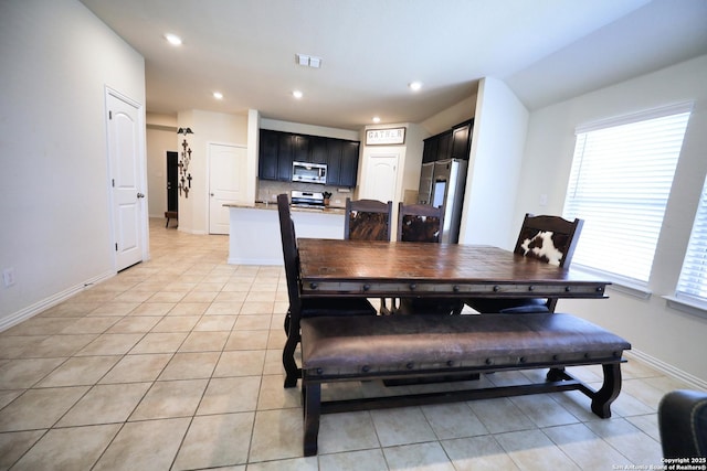 dining room with light tile patterned floors, visible vents, baseboards, and recessed lighting