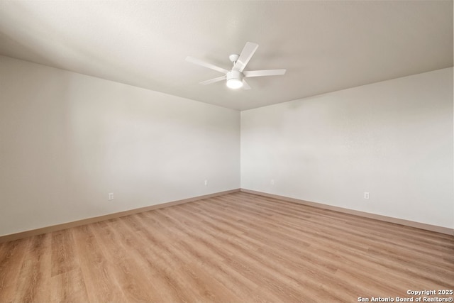 301 Vip Dr, Canyon Lake, TX 78133 - unfurnished room with baseboards, ceiling fan, and light wood finished floors