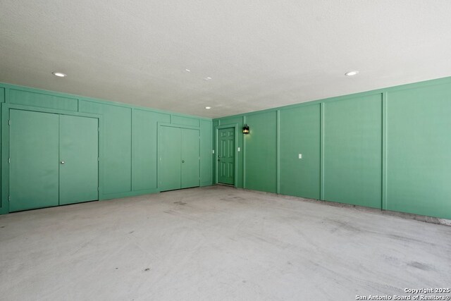 301 Vip Dr, Canyon Lake, TX 78133 - garage with a decorative wall and recessed lighting