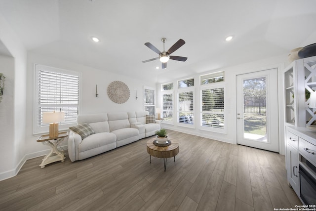 living area featuring recessed lighting, baseboards, ceiling fan, and wood finished floors