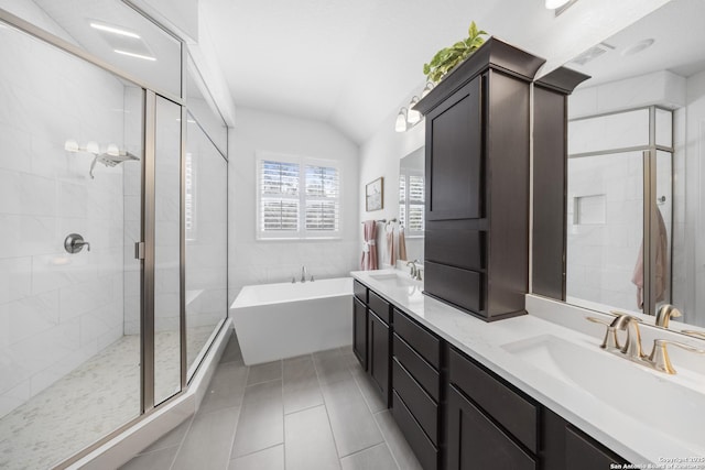 bathroom featuring visible vents, a shower stall, a bathing tub, tile patterned floors, and a sink