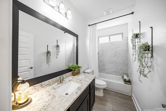 full bath with visible vents, shower / bathtub combination with curtain, toilet, wood finished floors, and vanity