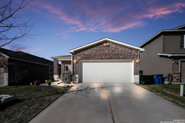 114 Texas Lantana, New Braunfels, TX 78130 - view of front of house featuring brick siding, concrete driveway, and a garage