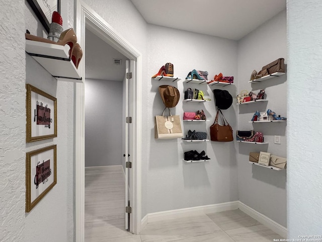 walk in closet with visible vents