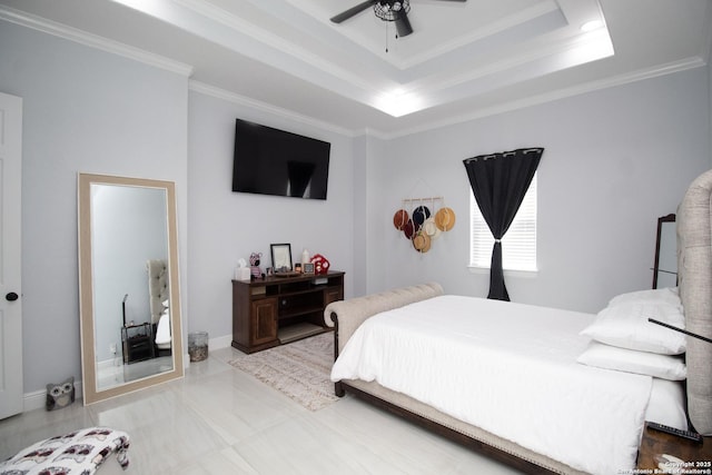 bedroom with a raised ceiling, crown molding, baseboards, and ceiling fan