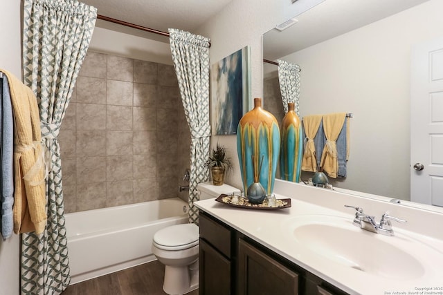 9303 Graze Land Dr, San Antonio, TX 78211 - bathroom with shower / tub combo with curtain, vanity, toilet, wood finished floors, and visible vents