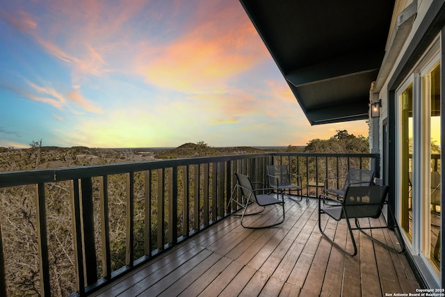 view of balcony at dusk