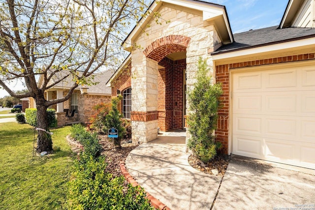 26823 Rustic Brk, San Antonio, TX 78261 - doorway to property featuring an attached garage, brick siding, stone siding, and a shingled roof
