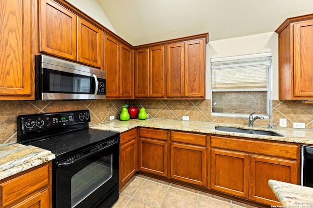 26823 Rustic Brk, San Antonio, TX 78261 - kitchen with tasteful backsplash, stainless steel microwave, light stone countertops, electric range, and a sink