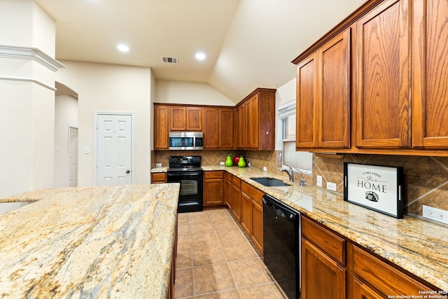 26823 Rustic Brk, San Antonio, TX 78261 - kitchen with visible vents, black appliances, a sink, backsplash, and light tile patterned floors