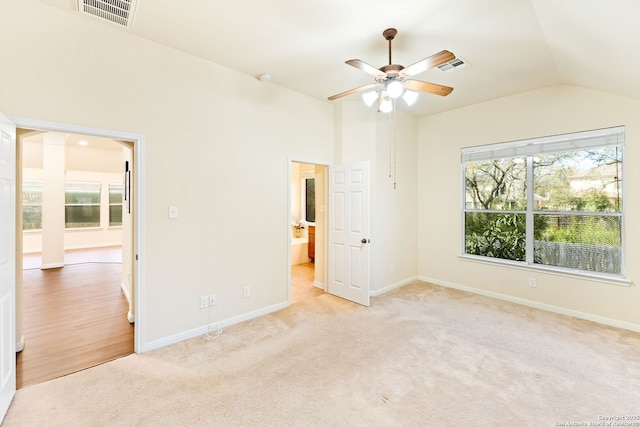 26823 Rustic Brk, San Antonio, TX 78261 - unfurnished bedroom with vaulted ceiling, baseboards, visible vents, and light carpet