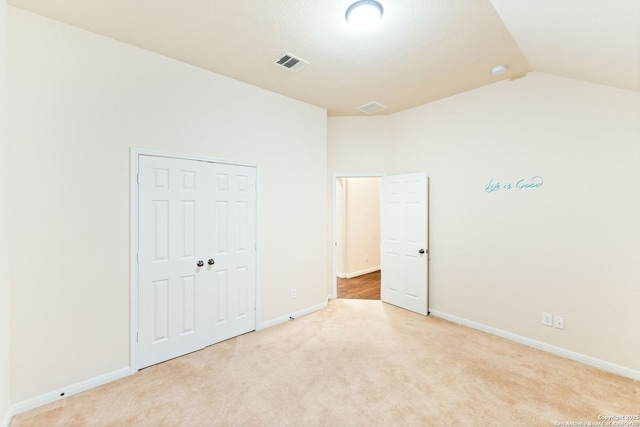 26823 Rustic Brk, San Antonio, TX 78261 - unfurnished bedroom featuring visible vents, lofted ceiling, carpet, and baseboards