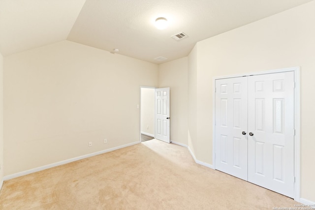 26823 Rustic Brk, San Antonio, TX 78261 - unfurnished bedroom featuring visible vents, baseboards, vaulted ceiling, light carpet, and a closet