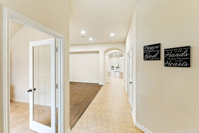 26823 Rustic Brk, San Antonio, TX 78261 - hallway with light tile patterned floors, baseboards, arched walkways, and recessed lighting