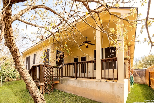 26823 Rustic Brk, San Antonio, TX 78261 - view of property exterior featuring a lawn, a porch, ceiling fan, and fence
