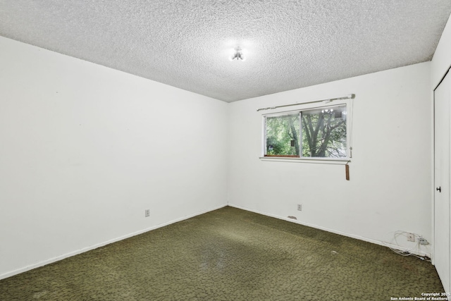 10103 Northampton, San Antonio, TX 78230 - unfurnished room with dark carpet, a textured ceiling, and baseboards