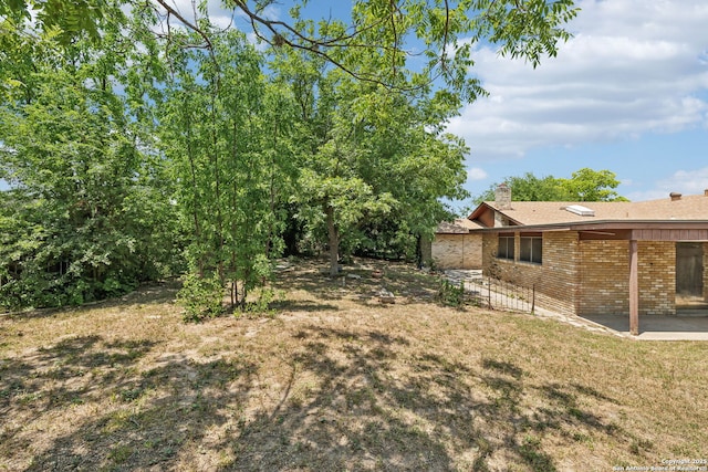 10103 Northampton, San Antonio, TX 78230 - view of green lawn featuring a patio area