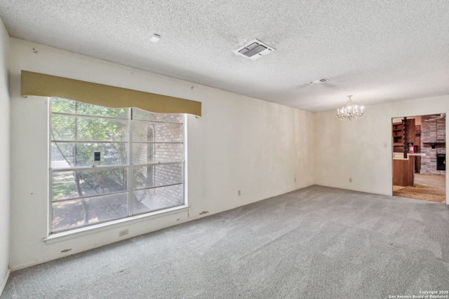 10103 Northampton, San Antonio, TX 78230 - unfurnished room with a chandelier, carpet flooring, and a textured ceiling