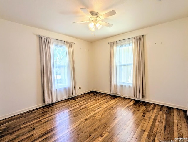 unfurnished room with baseboards, a ceiling fan, and hardwood / wood-style flooring