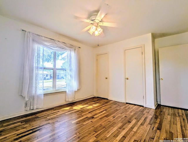 unfurnished bedroom with hardwood / wood-style flooring and ceiling fan