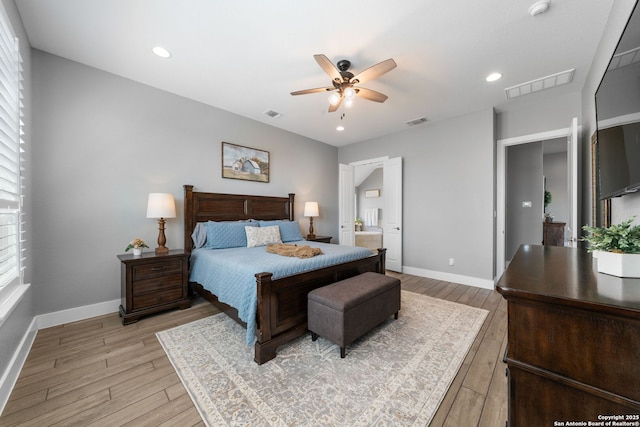 bedroom featuring light wood-style flooring, baseboards, and visible vents
