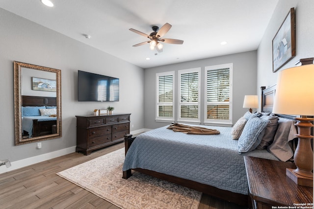 bedroom with recessed lighting, a ceiling fan, baseboards, and wood finished floors