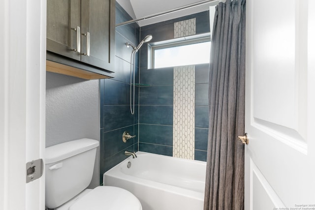 full bathroom featuring toilet, shower / bath combo, and a textured wall