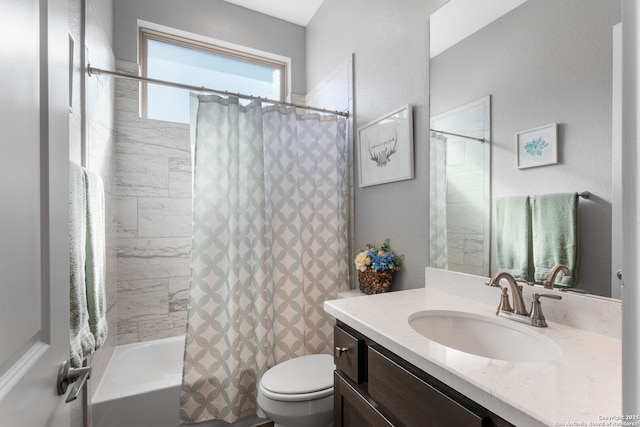 full bath with vanity, toilet, and shower / bath combo with shower curtain