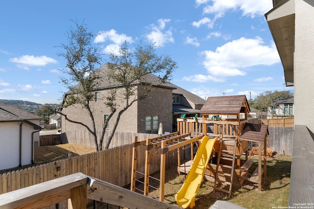 view of playground featuring fence