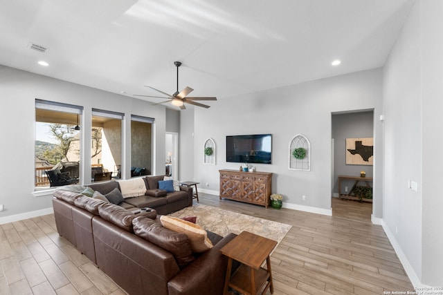living area with light wood finished floors, visible vents, baseboards, recessed lighting, and a ceiling fan