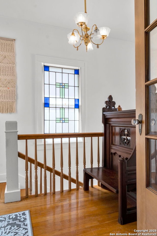 243 E Lullwood, San Antonio, TX 78212 - interior space with an upstairs landing, baseboards, an inviting chandelier, and wood finished floors