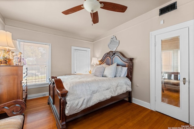 243 E Lullwood, San Antonio, TX 78212 - bedroom featuring wood finished floors, ceiling fan, baseboards, and visible vents